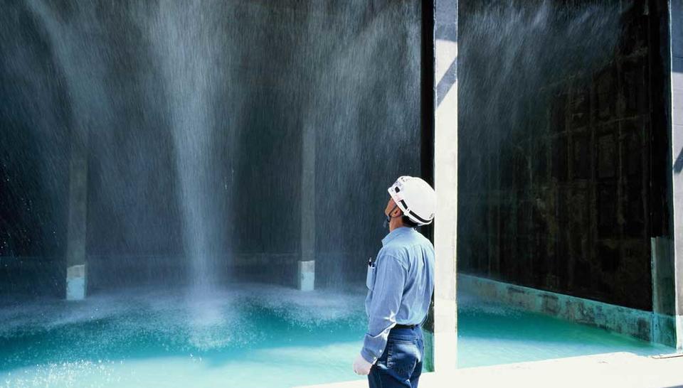 Veolia engineer inspecting high-pressure water purification system at LG / Lotte Chemical Daesan.